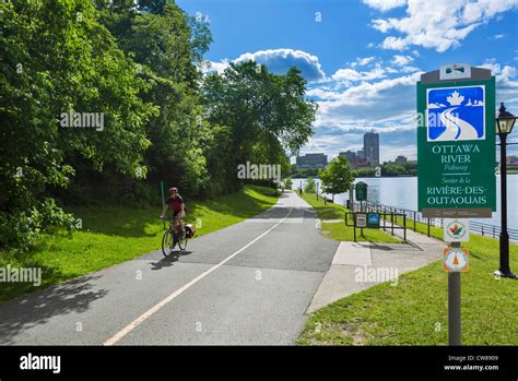 Cyclist on the the Ottawa River Pathway, Ottawa, Ontario, Canada Stock ...