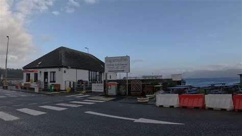 Coastal view of Armadale Ferry Terminal, Skye Island with clear skies, Buildings Stock Footage ...