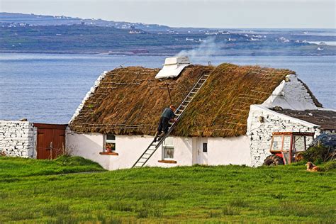 Traditional Thatch roof cottage Ireland Photograph by Pierre Leclerc Photography