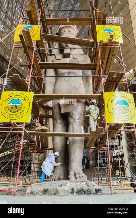 Egyptian Workers Restore A Giant Granite Statue Of The Ancient Egyptian