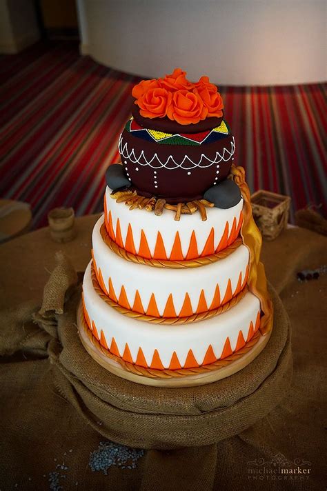 African Themed Wedding Cake With Orange And White Themed Wedding