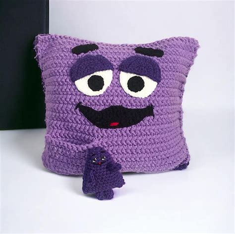 Ravelry: Grimace Cushion and Pocket Pal pattern by Trish Hoskin