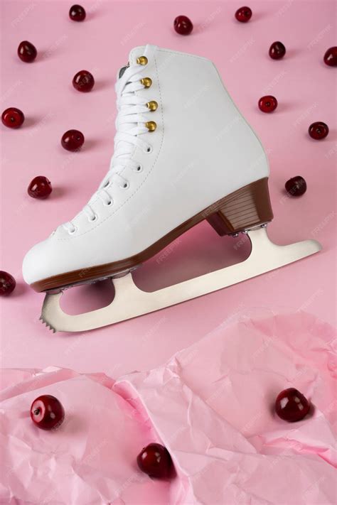 Free Photo View Of White Ice Skates With Cherries