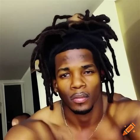 African American Man With Short Dreadlocks Taking A Mirror Selfie On