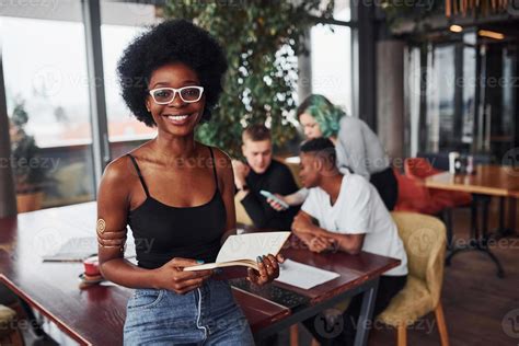 Black Woman Standing In Front Of Group Of Multi Ethnic People With