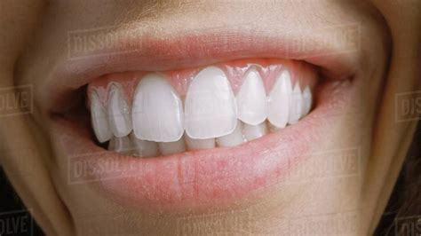 Close Up Macro Shot Of A Mouth With Perfect White Teeth Person Smiles