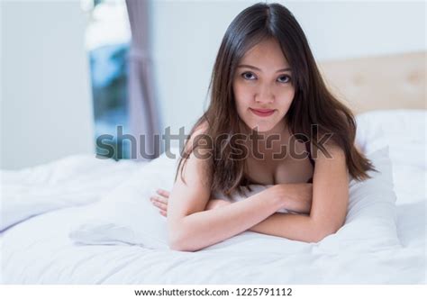 Sexy Asian Woman Purple Lingerie Lying Stock Photo