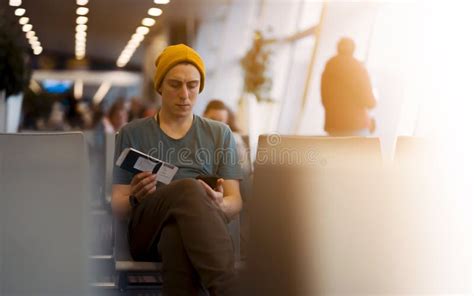 Man Is Sitting At The Airport Waiting For Flight Stock Photo Image