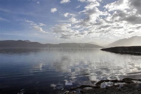 There Is A Quiet Blue Lake At The Foot Of The Mountain Stock Image