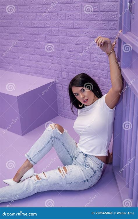 A Lovely Brunette Model Sits In A Lavender Jail Waiting To Plead Her Case Stock Photo Image Of