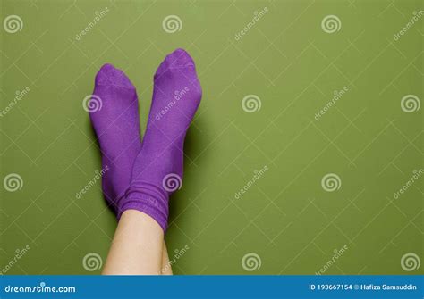 Woman In Purple Socks Close Up Conceptual Image Shot Stock Photo