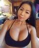 Busty Asian Babe Presents Her Generous Cleavage