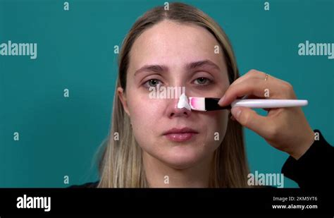 Woman Applies A White Nose Mask Against Blackheads On The Skin Stock Video Footage Alamy