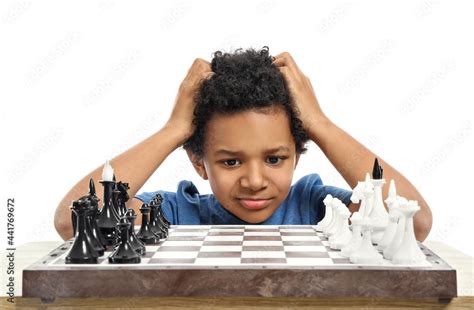 Cute African-American boy playing chess on white background Stock Photo ...