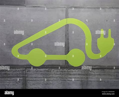 Electric car charging symbol in a parking lot Stock Photo - Alamy