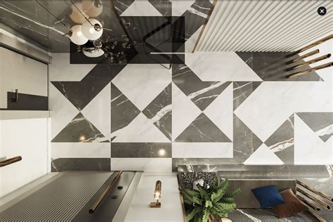 An Escalator In A Modern Building With Geometric Tiles On The Wall And