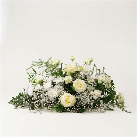 Funeral arrangement in white