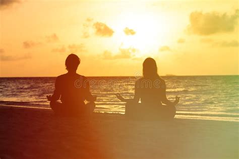 Silhouette of Couple Doing Yoga at Sunset Stock Image - Image of ...