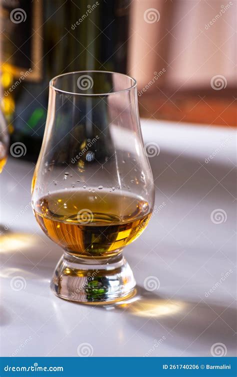 Tasting Of Whiskey Tulip Shaped Tasting Glasses With Dram Of Scotch