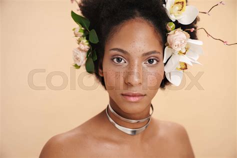 Portrait Of Half Naked African American Woman With Flowers In Her Hair