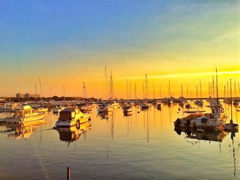 Premium Photo Boats In Harbor At Sunset