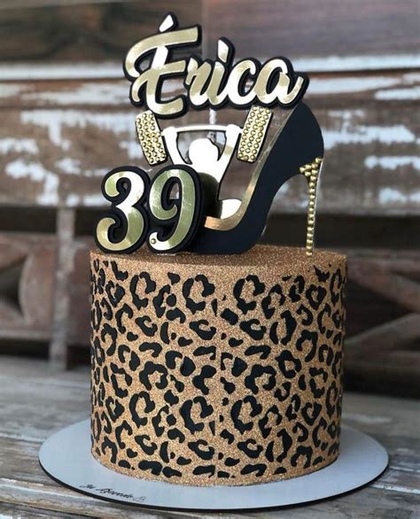 A Leopard Print Cake With A High Heel Shoe Topper On It S Side