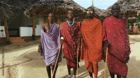 The Masai tribe dances their national African dance on the Indian Ocean ...