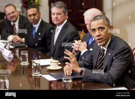 President Barack Obama And Vice President Joe Biden Meet With A Group