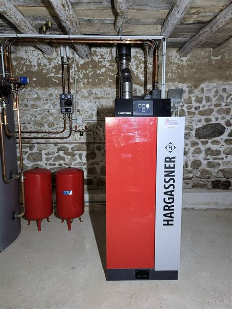 Installation d une chaudière Bois Bûches Hargassner Neo HV 30Kw