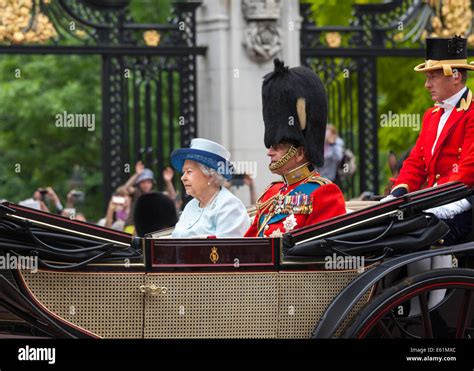 Her Majesty Queen Elizabeth Ii And Prince Philip In An Open Carriage At