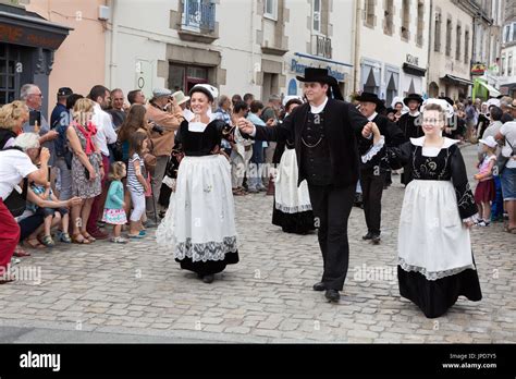 Brittany France Adults In Traditional Costume Parading In The Streets