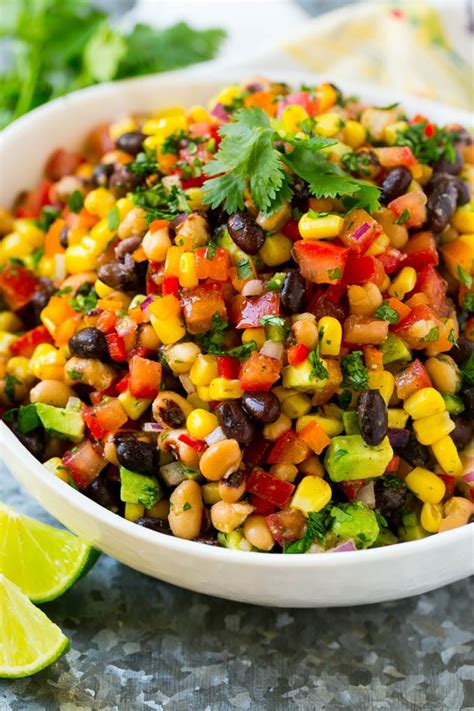 A Bowl Full Of Cowboy Caviar Made From Finely Diced Vegetables Beans