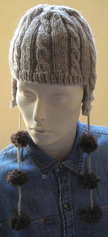 Knitted Cable Ear Flap Hat With Pom Pom Free Knitting Patterns