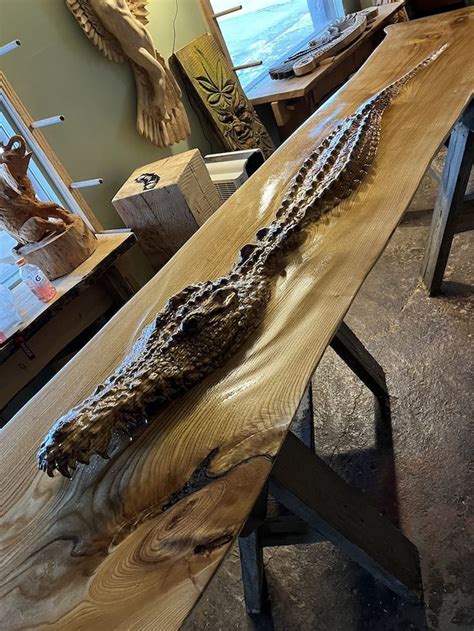 Woodworker Spends 100 Hours Carving A Crocodile Emerging From Wood Bar