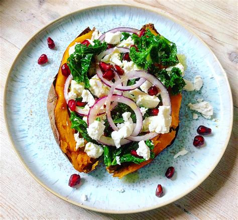 Baked Sweet Potato With Kale Feta Sweet Onion And Pomegranate