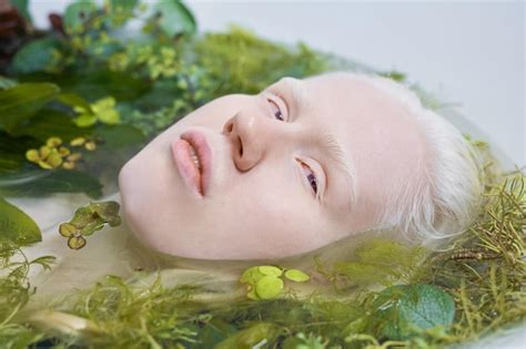 Premium Photo | Young albino woman with pale skin taking relaxing bath ...