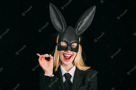 Premium Photo Portrait Of A Happy Woman In Bunny Ears Winking Young