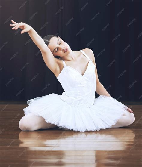 Premium Photo Ballerina Sitting On The Floor In A Studio Or On A