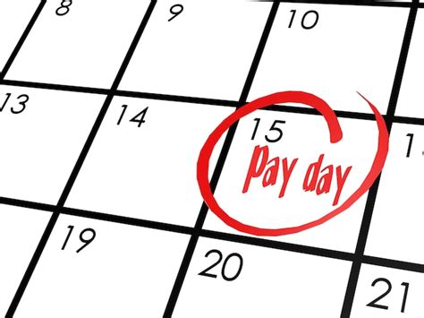 Premium Photo Pay Day Word On Calendar