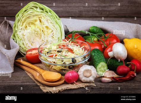 fresh vegetables  vegetable salad  dishes  wooden background