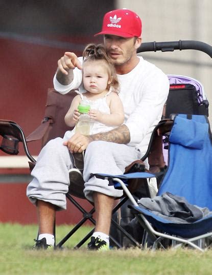 David Beckham Takes Baby Harper To Watch Her Brothers Play Soccer