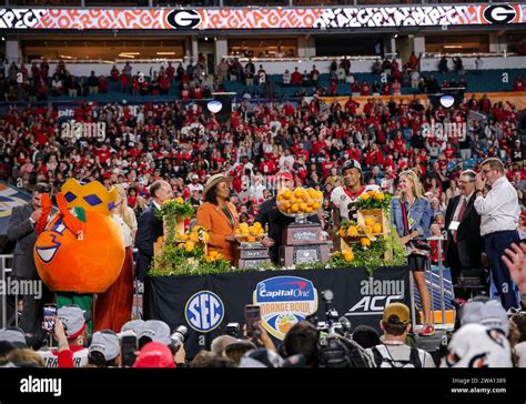 December 30, 2023:.Trophy presentations after the Capital One Orange ...