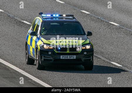 Lancashire Police traffic policemen driving patrol vehicles on Bank ...