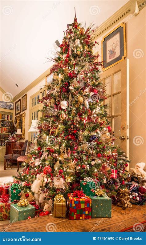 Presents Under Decorated Christmas Tree In Den Stock Photo Image Of