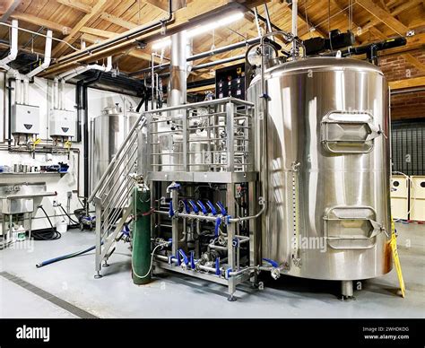 Stainless Steel Brewing Tank Fermenting Beer At A Craft Brewery Stock