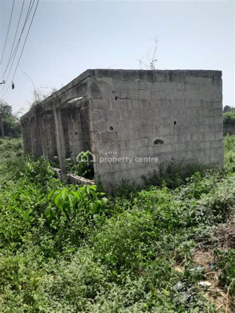 For Sale Fenced Plot Of Land With Uncompleted Shops Adjacent Rice