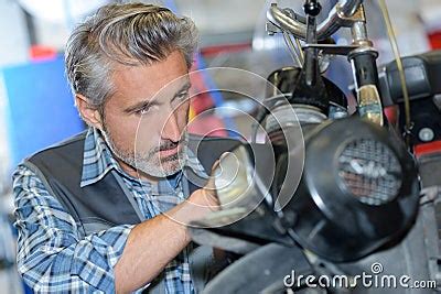 He Fixing Motorbike Stock Photography CartoonDealer 211992854