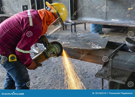 Worker Is Used Grinding Machine To Grinding Surface Of Steel Plate