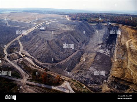 Aerial View Of Open Pit Coal Mine And Dragline Digging Machine Stock