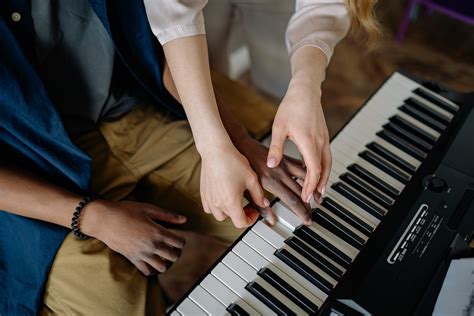 Hands Pressing Piano Keys · Free Stock Photo